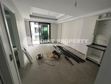 1+1 apartments with fine finishing in a house at the final stage of construction in the center of the popular Mahmutlar area.-id-4162-photo-3