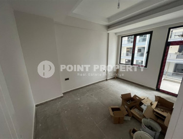 1+1 apartments with fine finishing in a house at the final stage of construction in the center of the popular Mahmutlar area.-id-4162-photo-4