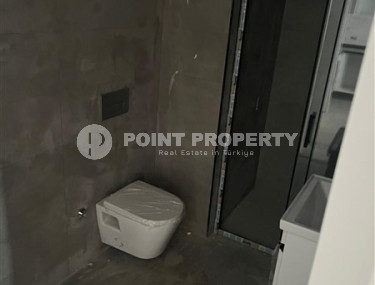 1+1 apartments with fine finishing in a house at the final stage of construction in the center of the popular Mahmutlar area.-id-4162-photo-5