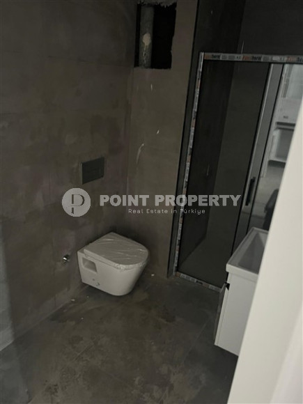 1+1 apartments with fine finishing in a house at the final stage of construction in the center of the popular Mahmutlar area.-id-4162-photo-5