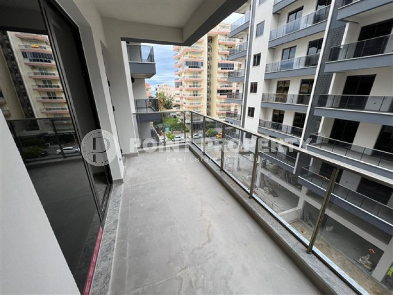 1+1 apartments with fine finishing in a house at the final stage of construction in the center of the popular Mahmutlar area.-id-4162-photo-7