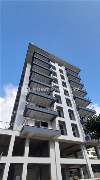 1+1 apartments with fine finishing in a house at the final stage of construction in the center of the popular Mahmutlar area.-id-4162-photo-9