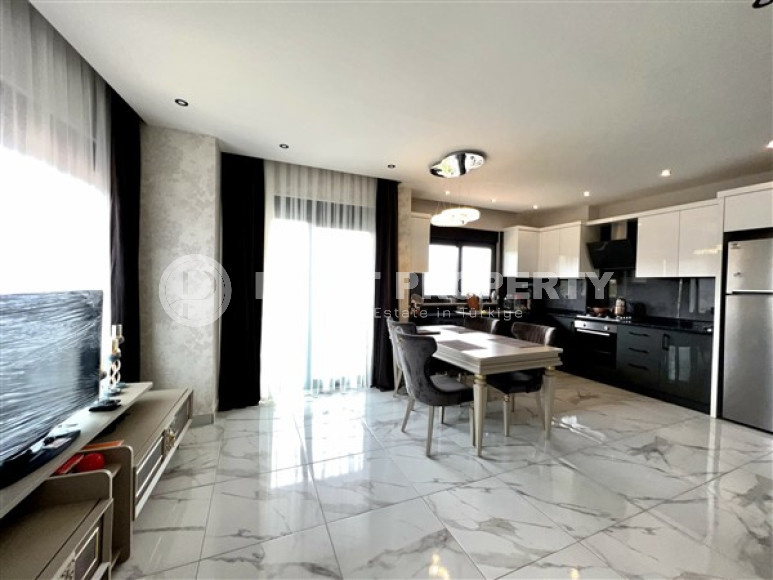 Modern duplex 2+1 on the 4th floor with an attic in a residential complex, commissioned in 2021.-id-4178-photo-2