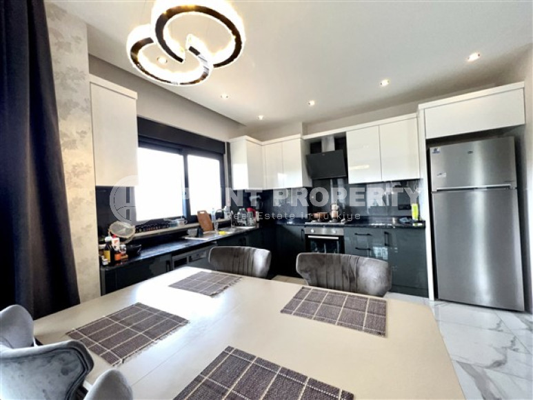 Modern duplex 2+1 on the 4th floor with an attic in a residential complex, commissioned in 2021.-id-4178-photo-3