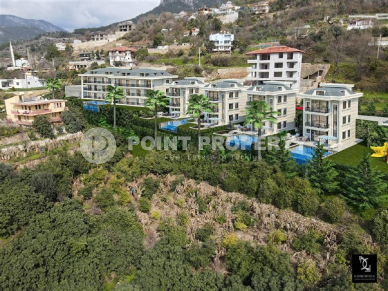 Apartments with different layouts and square footage in a residential complex under construction in the elite Kestel area of Alanya. Description:-id-4181-photo-6
