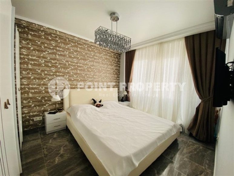 Большая двухуровневая квартира на 11-м этаже с мансардой в центре современного района Махмутлар.-id-4200-фото-4