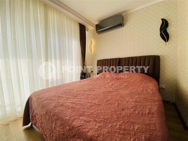 Большая двухуровневая квартира на 11-м этаже с мансардой в центре современного района Махмутлар.-id-4200-фото-6