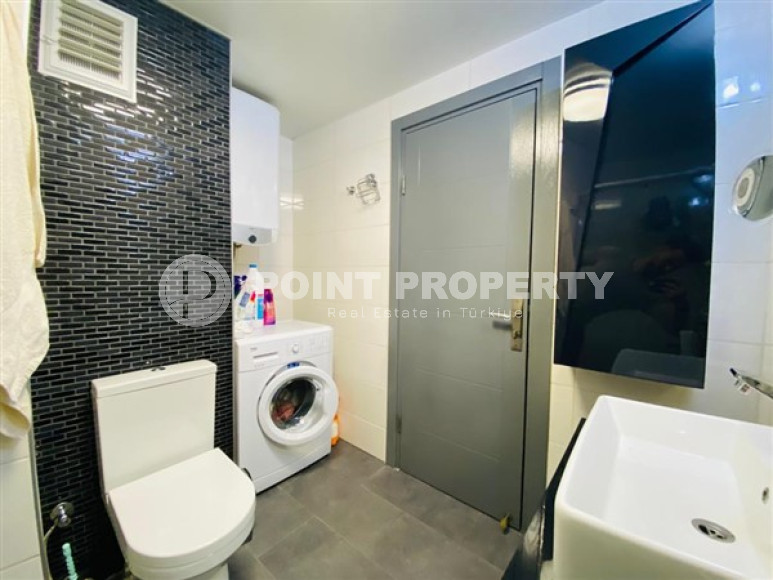 Большая двухуровневая квартира на 11-м этаже с мансардой в центре современного района Махмутлар.-id-4200-фото-9