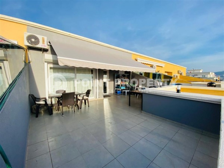 Большая двухуровневая квартира на 11-м этаже с мансардой в центре современного района Махмутлар.-id-4200-фото-10