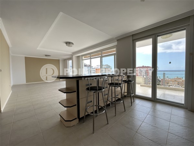 Панорамный дуплекс с чистовой отделкой на 11-м этаже с мансардой в центре района Махмутлар.-id-4201-фото-5