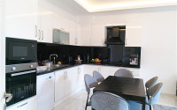 Beautiful modern apartment with two bedrooms 300 meters from the sea in the elite area of Kestel.-id-4230-photo-2
