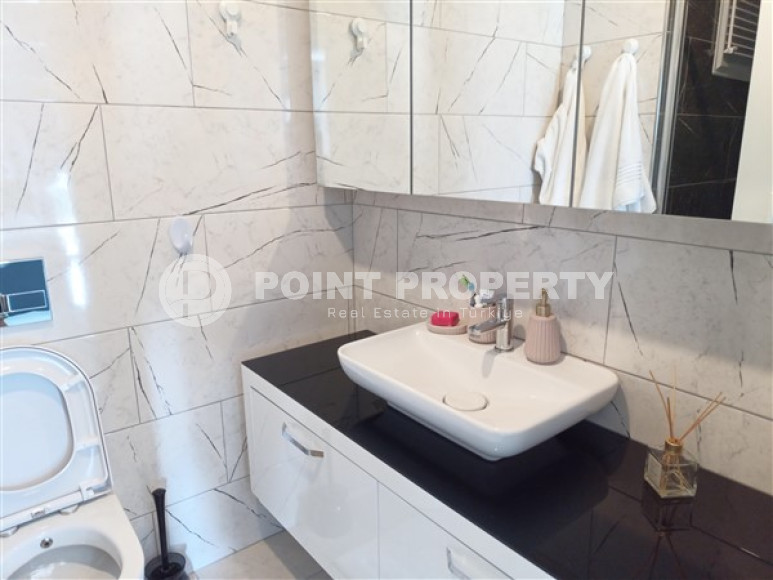 Beautiful modern apartment with two bedrooms 300 meters from the sea in the elite area of Kestel.-id-4230-photo-6