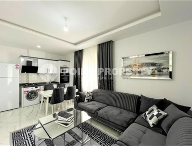 Stylish 1+1 apartment on the 3rd floor 700 meters from the sea in the center of the popular Mahmutlar area.-id-4248-photo-2