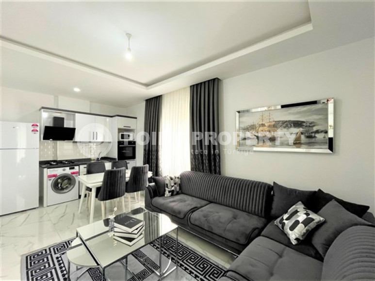 Stylish 1+1 apartment on the 3rd floor 700 meters from the sea in the center of the popular Mahmutlar area.-id-4248-photo-2