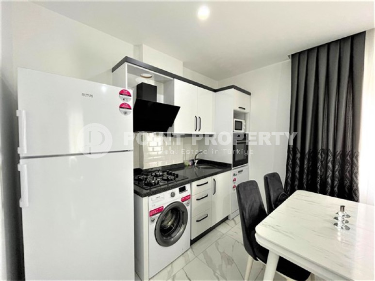 Stylish 1+1 apartment on the 3rd floor 700 meters from the sea in the center of the popular Mahmutlar area.-id-4248-photo-3