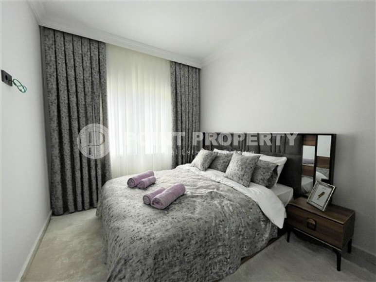 Stylish 1+1 apartment on the 3rd floor 700 meters from the sea in the center of the popular Mahmutlar area.-id-4248-photo-4