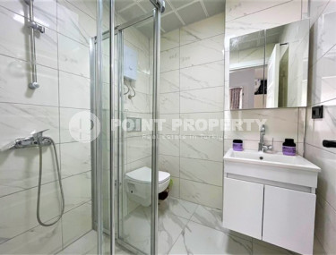 Stylish 1+1 apartment on the 3rd floor 700 meters from the sea in the center of the popular Mahmutlar area.-id-4248-photo-5