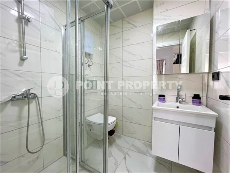 Stylish 1+1 apartment on the 3rd floor 700 meters from the sea in the center of the popular Mahmutlar area.-id-4248-photo-5