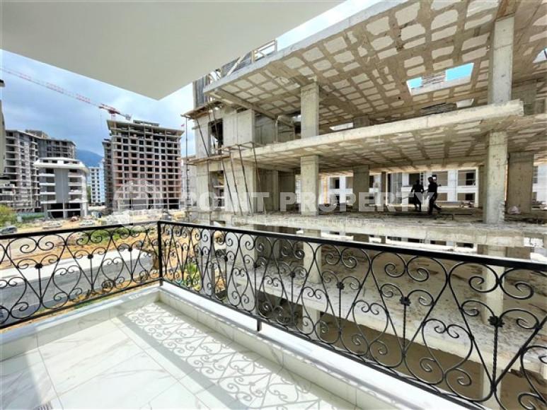 Stylish 1+1 apartment on the 3rd floor 700 meters from the sea in the center of the popular Mahmutlar area.-id-4248-photo-6