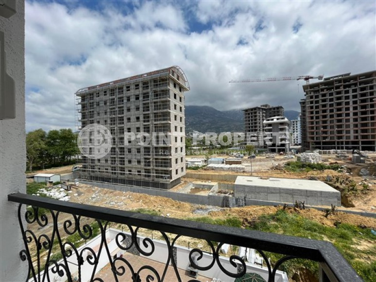 Stylish 1+1 apartment on the 3rd floor 700 meters from the sea in the center of the popular Mahmutlar area.-id-4248-photo-7