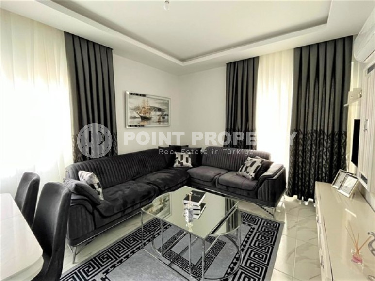 Stylish 1+1 apartment on the 3rd floor 700 meters from the sea in the center of the popular Mahmutlar area.-id-4248-photo-8