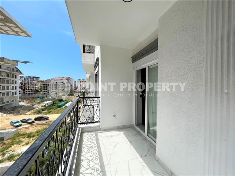 Stylish 1+1 apartment on the 3rd floor 700 meters from the sea in the center of the popular Mahmutlar area.-id-4248-photo-9