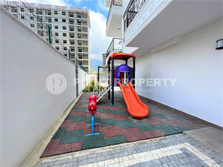 Stylish 1+1 apartment on the 3rd floor 700 meters from the sea in the center of the popular Mahmutlar area.-id-4248-photo-12