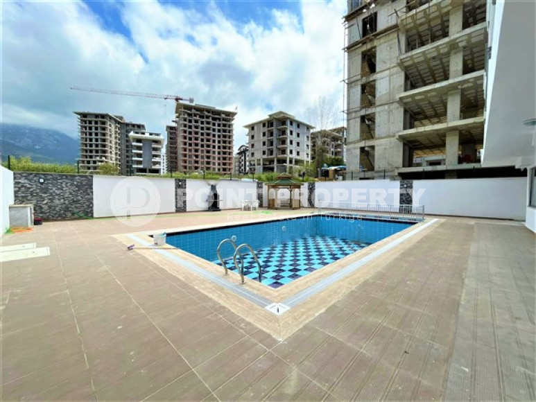 Stylish 1+1 apartment on the 3rd floor 700 meters from the sea in the center of the popular Mahmutlar area.-id-4248-photo-13