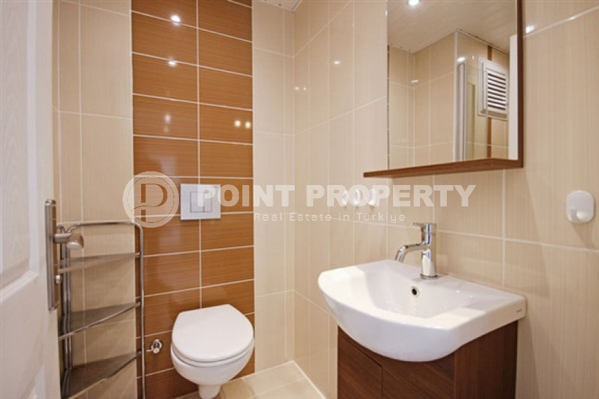 Beautiful bright duplex on the 10th floor with an attic in the center of the popular developed area of Mahmutlar.-id-4287-photo-7