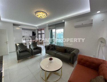 Светлые просторные апартаменты с двумя спальными комнатами на 4-м этаже в центре района Махмутлар.-id-4293-фото-4