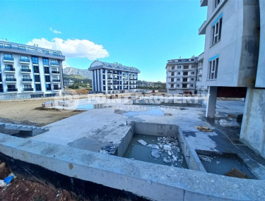 Small 1+1 apartment in a residence under construction in the prestigious Upper Oba area.-id-4308-photo-2