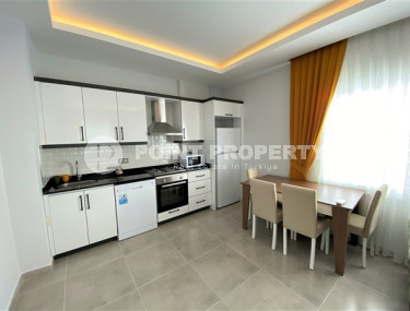 Классическая двухкомнатная квартира с мебелью в районе Махмутлар. Жилая площадь 56 м2.-id-4316-фото-3