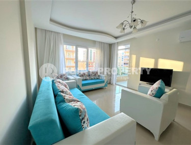 Beautiful bright 1+1 apartment, with a total area of 70 m2, 300 meters from the sea in the center of Alanya's popular Mahmutlar area.-id-4326-photo-1
