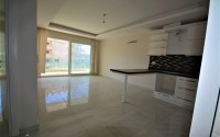 Spacious 1+1 apartments with fine finishing in the center of Mahmutlar and 200 meters from the sea.-id-4344-photo-1
