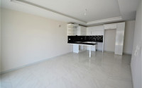 Spacious 1+1 apartments with fine finishing in the center of Mahmutlar and 200 meters from the sea.-id-4344-photo-2