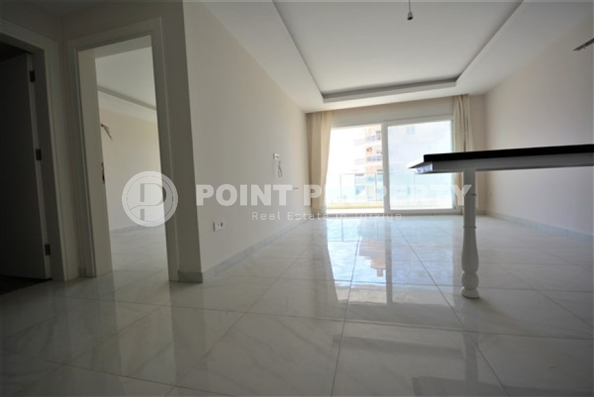 Spacious 1+1 apartments with fine finishing in the center of Mahmutlar and 200 meters from the sea.-id-4344-photo-3
