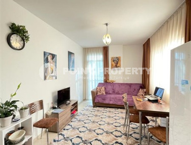 Small budget apartment 1+1 on the 3rd floor in a building built in 2011 with a swimming pool and garden.-id-4345-photo-1