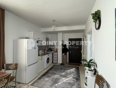 Small budget apartment 1+1 on the 3rd floor in a building built in 2011 with a swimming pool and garden.-id-4345-photo-2