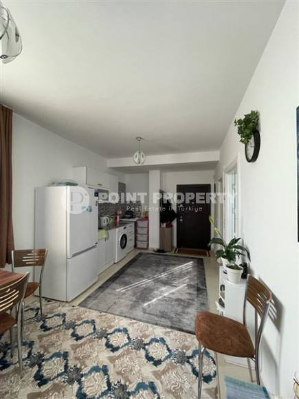 Small budget apartment 1+1 on the 3rd floor in a building built in 2011 with a swimming pool and garden.-id-4345-photo-2