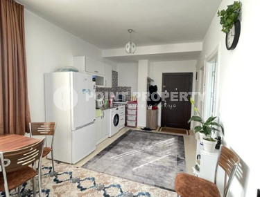 Small budget apartment 1+1 on the 3rd floor in a building built in 2011 with a swimming pool and garden.-id-4345-photo-3