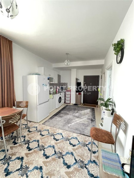 Small budget apartment 1+1 on the 3rd floor in a building built in 2011 with a swimming pool and garden.-id-4345-photo-3