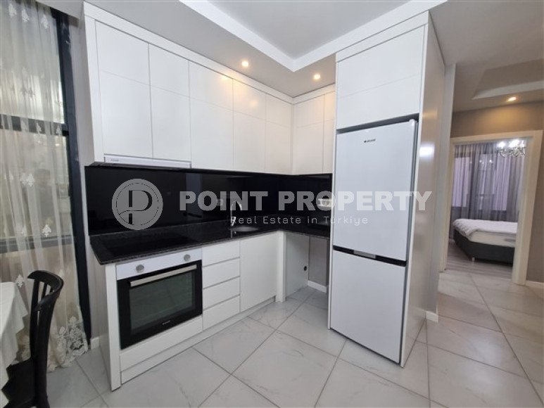 Новая комфортабельная квартира с современным дизайном в 350 метрах от моря в экологически чистом районе Тосмур.-id-4346-фото-2