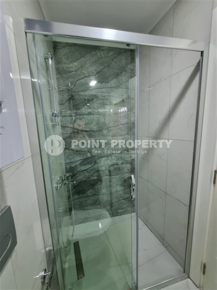 Новая комфортабельная квартира с современным дизайном в 350 метрах от моря в экологически чистом районе Тосмур.-id-4346-фото-5