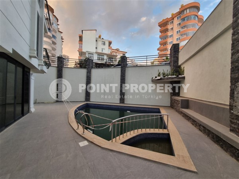 Новая комфортабельная квартира с современным дизайном в 350 метрах от моря в экологически чистом районе Тосмур.-id-4346-фото-8