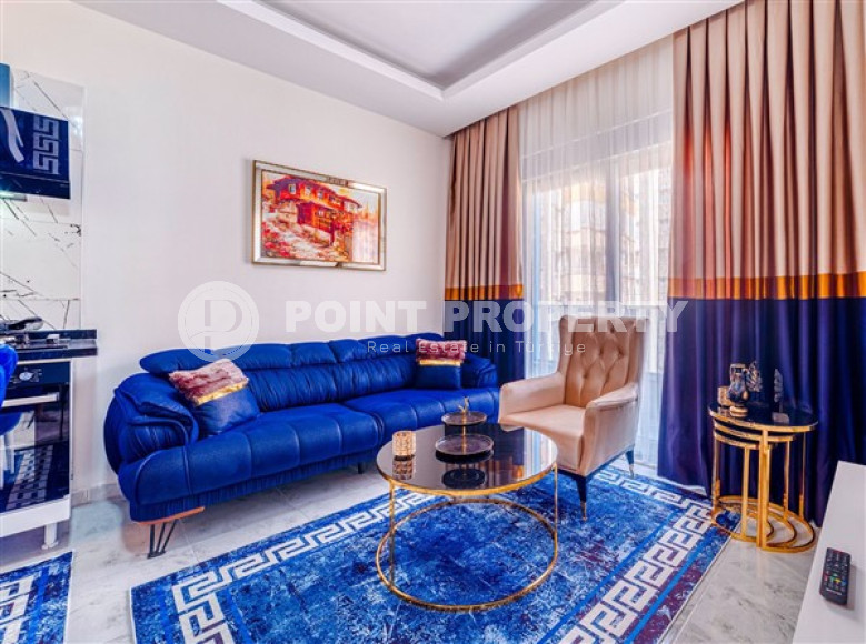 Inexpensive apartment of 60 m2 with a beautiful interior and excellent location 100 meters from the center of Mahmutlar-id-4352-photo-1