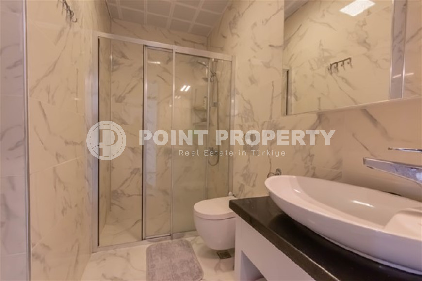 Bright modern 1+1 apartment 500 meters from the sea in the center of Mahmutlar.-id-4360-photo-7