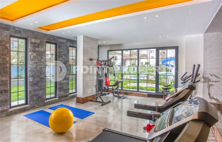 Bright modern 1+1 apartment 500 meters from the sea in the center of Mahmutlar.-id-4360-photo-12