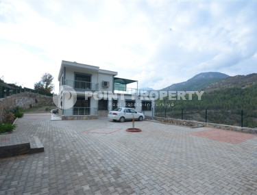 Two-storey villa with a swimming pool in a mountainous area eighteen kilometers from the sea and the center of the Demirtas district.-id-4423-photo-1