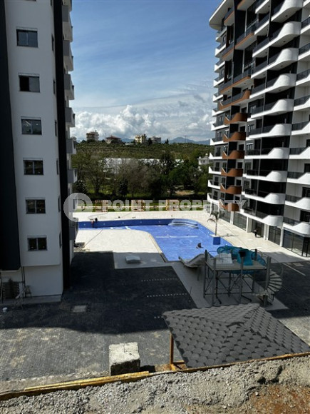 Апартаменты с площадью 51 м2 на 7 этаже высотной резиденции, район Махмутлар-id-4438-фото-10