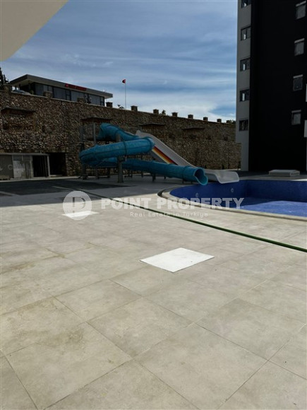 Апартаменты с площадью 51 м2 на 7 этаже высотной резиденции, район Махмутлар-id-4438-фото-16